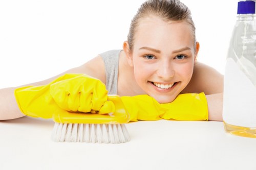 Commercial cleaning team disinfecting high-touch surfaces