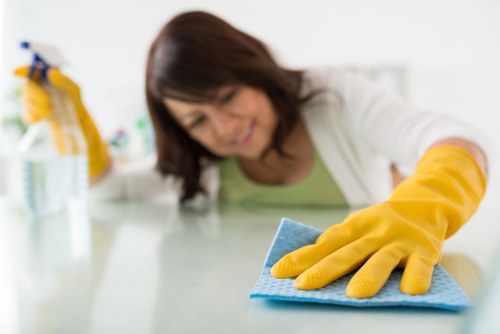 Regular cleaning of high-touch surfaces in a modern office